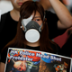 A protester covers her eye in solidarity with young woman who was shot on the eye with a projectile in August.
